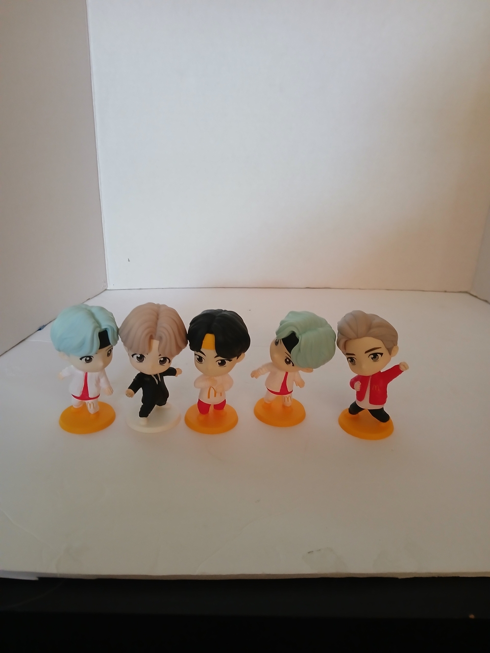 BTS TinyTAN figures from a McDonald's collaboration, featuring stylized characte